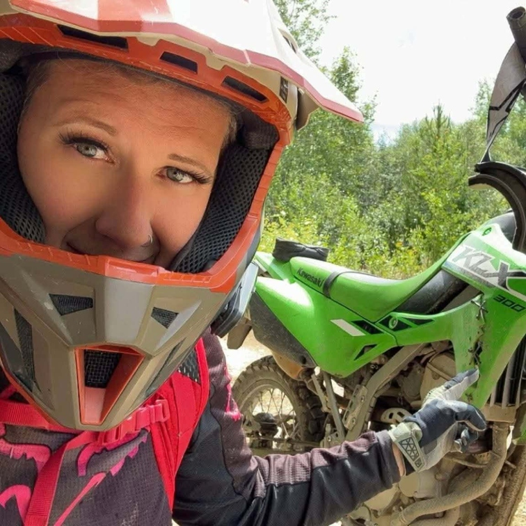Cindy Young on a motorcycle looking into the camera