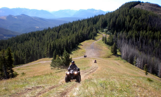 ATV going up a mountain trail. 