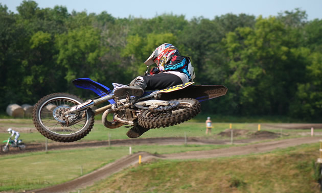 A dirt rider whips a bike during practice for a race at Grunthal MX Track. 