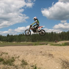 a guy riding on a dirt bike
