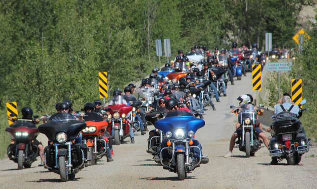 The road crossing the Horsethief Creek Bridge is packed with riders lining up for the Poker Run at the Memorial Rally.
