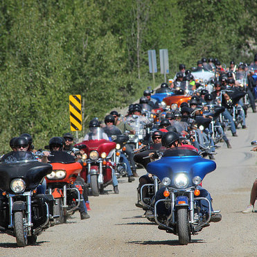 The road crossing the Horsethief Creek Bridge is packed with riders lining up for the Poker Run at the Memorial Rally.