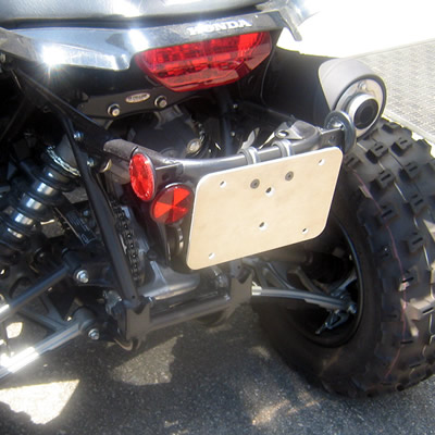 Licence plate mount on an ATV. 