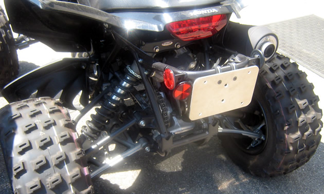 Licence plate mount on an ATV. 
