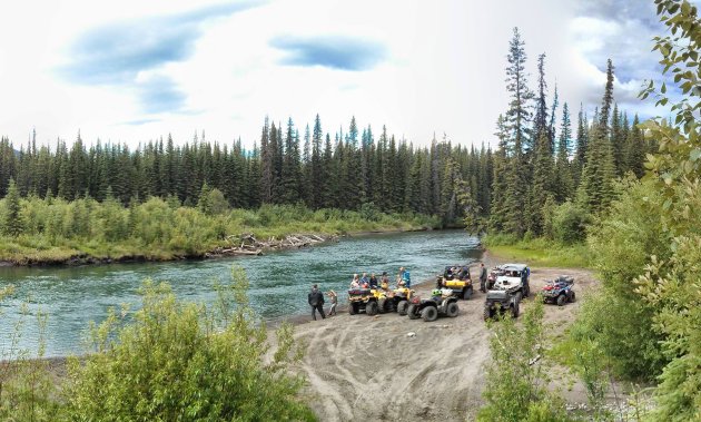 Moose Members take a brake on the edge of the crystal clear waters of the Graham River. North-West of Fort St. John, B.C.