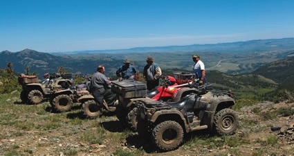 ATVs on a hilltop