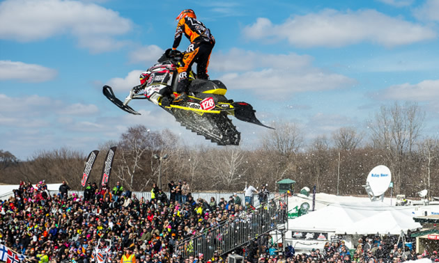 Flying through the air in a snocross race. 