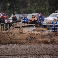 A truck completely covered in mud.