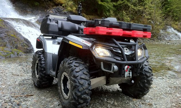 Photo of a quad with low profile fuel packs on the front racks. 
