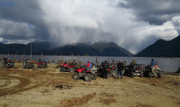 Powell River B.C. ATV Club taking a break at Lois Lake, and overlooking the looming storm.
