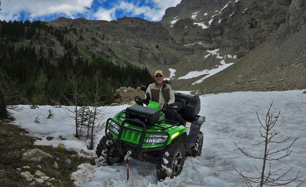 Doug Williamson sitting on his Arctic Cat TRV.