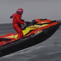 A red and yellow search and rescue watercraft. 