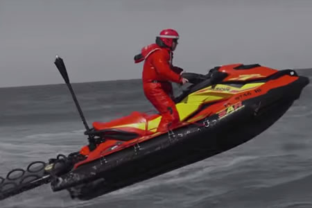 A red and yellow search and rescue watercraft. 