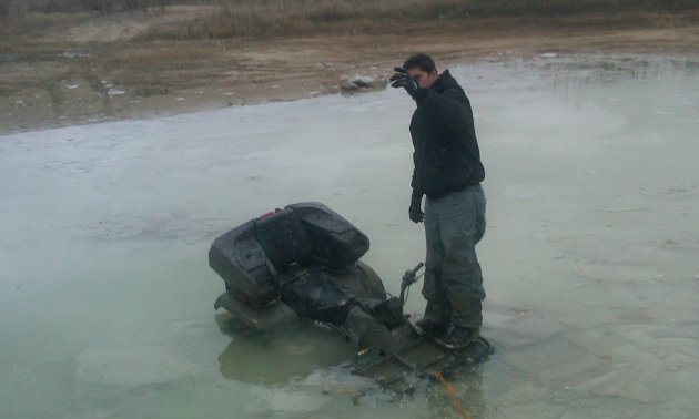 Riding a 2003 Arctic Cat 400, this rider found out how deep it really was - the hard way.