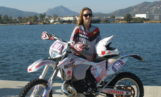 Shelby Turner and her bike in front of a lake in Italy. 