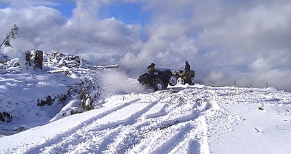 Photo of people ATVing in the winter