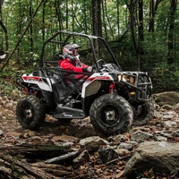 Photo of two Polaris Sprtsman Ace on a backcountry trail.