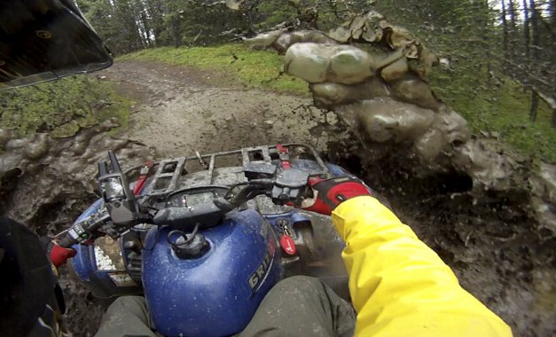 Photo from a helmet cam of riding through deep mud. 