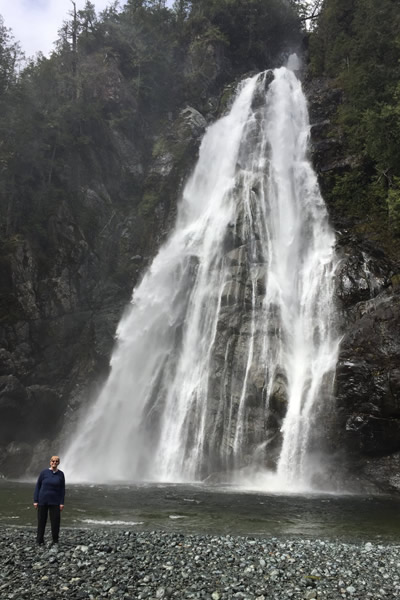 Len Cherry's wife, Venetia, stands in front of Virgin Falls near Tofino, the focus of the Alberni Valley Hill Climbers latest trek. 