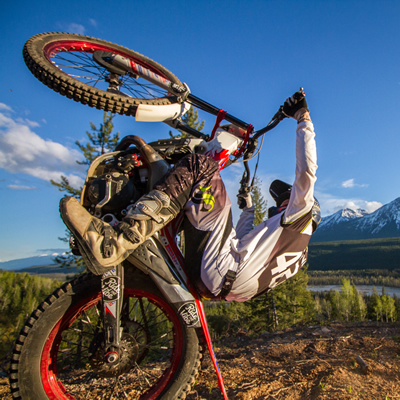 Sam King pulling the ultimate wheelie on his dirt bike. 