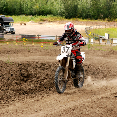 Motocross rider ripping down the track. 