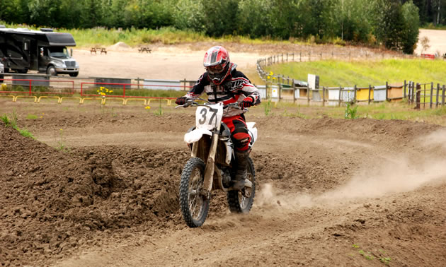 Motocross rider ripping down the track. 