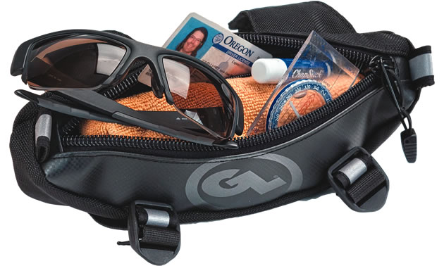 A small black and grey handlebar bag with sunglasses, wallet and driver's licence in it. 